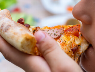 pizza with home delivery, eat at the table against the background of food