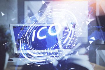 Multi exposure of blockchain and crypto economy theme hologram and table with computer background....