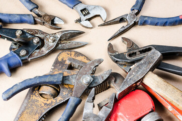 Pile of old tools for construction and repair of plumbing .