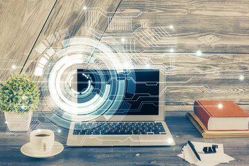 Double exposure of desktop computer and technology theme hologram. Concept of software development.