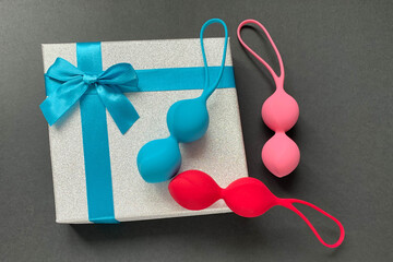 Sex toys. Three jiggle balls balls on a black background. Useful for sex shop, adults