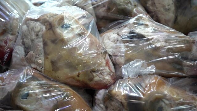 Goat Heads in Plastic Bags on Shop Display in Kurdistan, Iraq, Close Up. Bizzare Local Cuisine