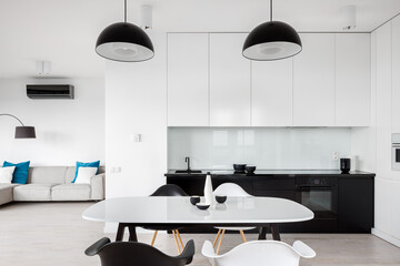 White dining table in open kitchen