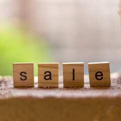 View of block lettering on SALE on stone background. business and shopping concept