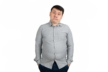 Unhappy young overweight man with a big belly isolated on white background.	