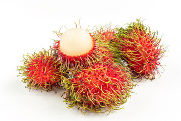 Small group of rambutanSmall group of rambutan with one peeled half rambutan put on top. Isolated close up image on white background. Close up tropical fruits of Thailand.