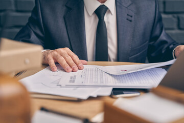Fototapeta premium Focused photo on male hands that holding documents