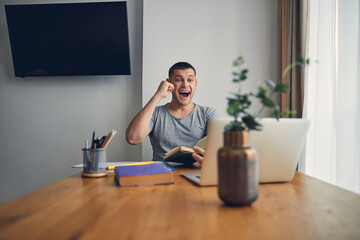 Successful young man raising hand of happiness
