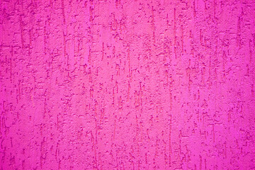 Background of magenta stone wall with textured drips.