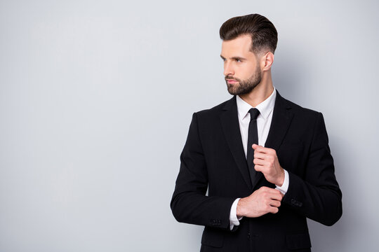 Profile side photo of charismatic serious worker man adjust cufflinks look copyspace prepare for business meeting wear classy clothes isolated over grey color background