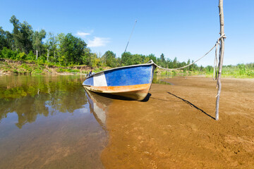 Boat on the river Bank on a summer morning