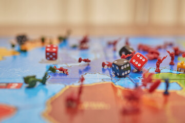 board game, lots of figures from the risk game, and the dice falling on top and destroying...