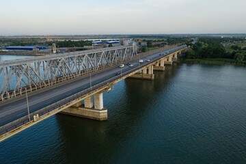 Highway and railway bridges over river. Aerial view.
