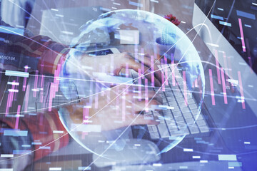 Naklejka na ściany i meble Double exposure of stock market chart with man working on computer on background. Concept of financial analysis.