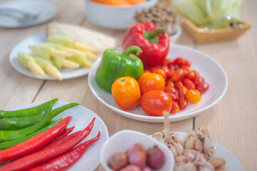 Fresh vegetable and fruit on wooden table in kitchen