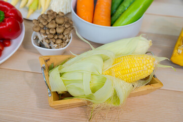 Fresh vegetable and fruit on wooden table in kitchen
