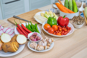 Fresh vegetable and fruit on wooden table in kitchen