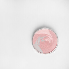 makeup Highlighter (powder illuminator) on white background; vanity concept