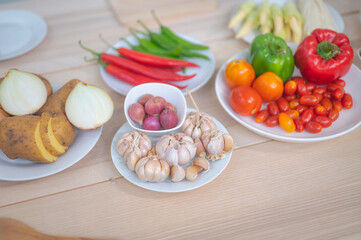 Fresh vegetable and fruit on wooden table in kitchen