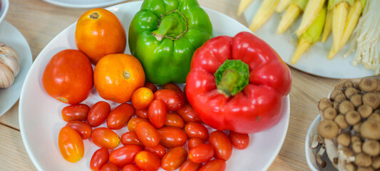 Fresh vegetable and fruit on wooden table in kitchen