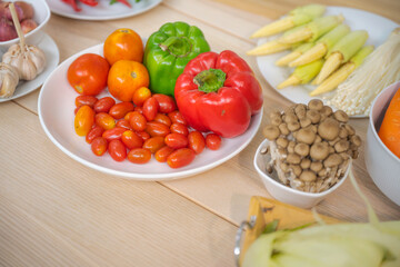 Fresh vegetable and fruit on wooden table in kitchen
