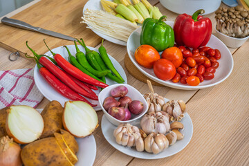 Fresh vegetable and fruit on wooden table in kitchen