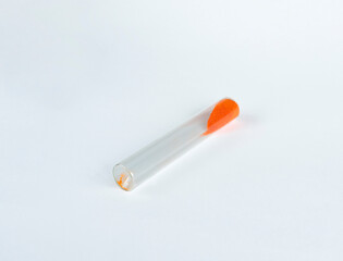 loose orange substance in a flask, medicine