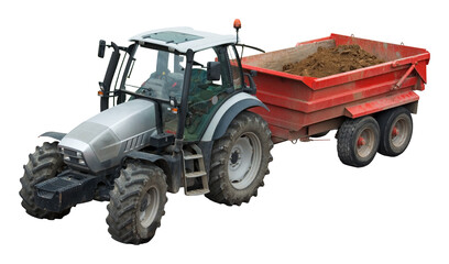 Heavy tractor pulling a trailer loaded with dirt from a construction site. Isolated on white.