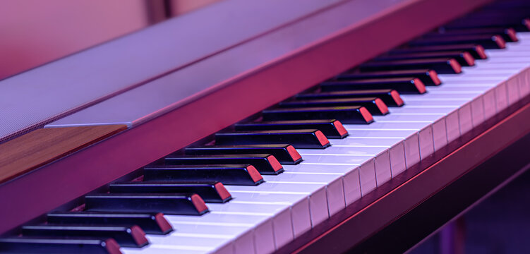 Piano keys on a beautiful colored background.