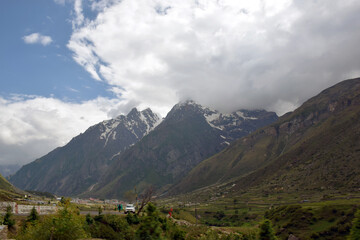 Fototapeta premium Different views of the mountains with blue sky and clouds