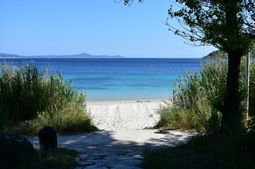 Bay with turquoise water and beach with white sand and blue sky. San Francisco beach, Muros, Galicia, Spain.