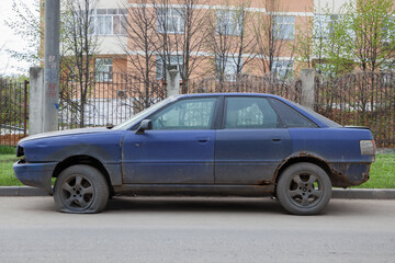 Old car parked by the road