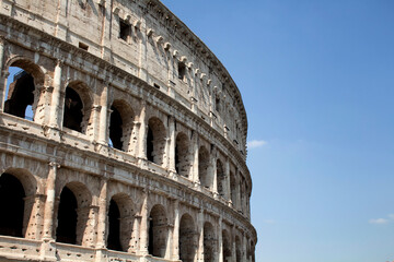 Fototapeta premium Bottom view of Colesseum with sky background in ancient Rome city