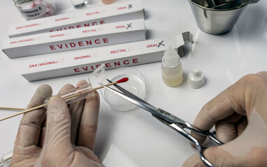 Specialized criminalistic police cut with blood swab scissors, DNA analysis, conceptual image
