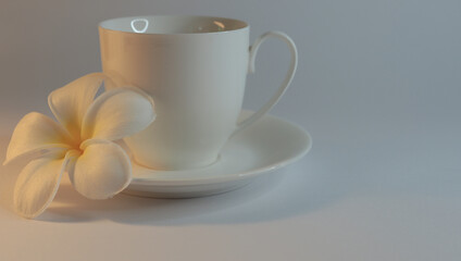 Obraz na płótnie Canvas coffee cup with lelawadee flower