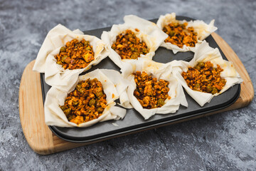 plant-based food, vegan filo pastries with spicy tofu and peas filling