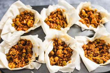plant-based food, vegan filo pastries with spicy tofu and peas filling