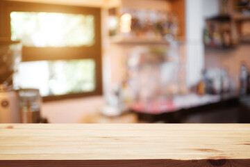 Empty desk space platform over blurred restaurant or coffee shop background for product display montage.