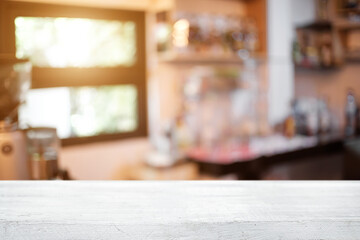 Empty desk space platform over blurred restaurant or coffee shop background for product display montage.