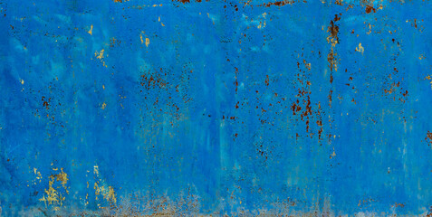 Texture, old metal gate painted with blue peeling paint with spots of rust