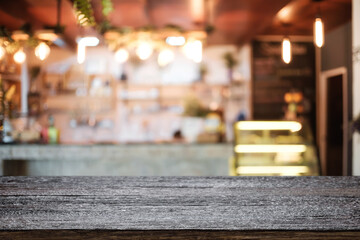 Empty wooden table space platform and blurred resturant or coffee shop background for product display montage.