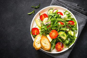 Green salad from leaves and vegetables.
