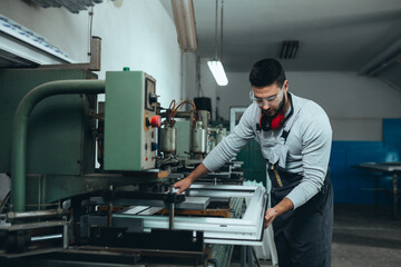 PVC industry worker making PVC frames for windows and doors