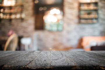 Empty wooden table space platform and blurred resturant or coffee shop background for product display montage.