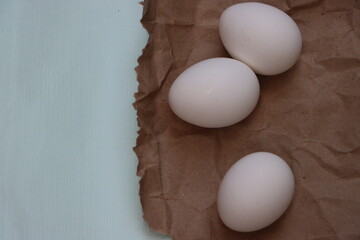 White eggs on brown background, healthy food