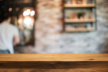 Empty wooden table space platform and blurred resturant or coffee shop background for product display montage.