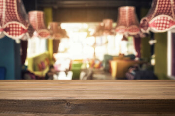 Empty wooden table space platform and blurred resturant or coffee shop background for product display montage.
