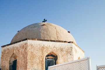 Fototapeta na wymiar Dome of a church in Santorini