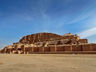 Side view on remains of ziggurat Chogha Zanbil, one of few existent ziggurats in world. Complex is object no.1 in UNESCO Heritage List in Iran (Shush). Site is popular among local & foreign tourists