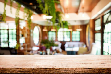 Empty wooden table space platform and blurred resturant or coffee shop background for product display montage.